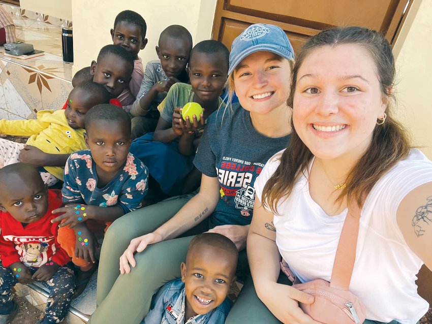AFRICAN MISSION &mdash; Riley Heiliger, right, of Wright City, recently traveled to Tanzania, Africa with the charitable organization Humanity for Children. Her team provided education and care to birthing mothers and newborns in the poverty stricken country. Heiliger will graduate from Westminster College in May and pursue her goal to become a physician&rsquo;s assistant in the area of obstetrics and gynecology. The items in the photo were given to her by local women she served in Tanzania.