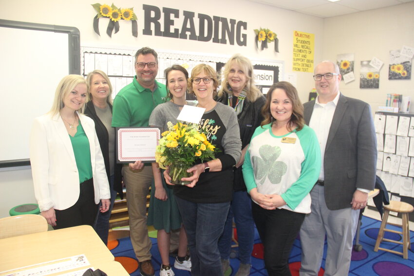 TEACHER OF THE YEAR &mdash; Milissa Greene (center) is Warren County R-III School District&rsquo;s Teacher of the Year. Greene is a special education teacher at Warrior Ridge Elementary. She was joined by coworkers to congratulate her for the award.
