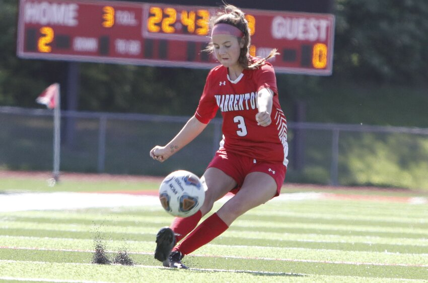 Warrenton senior Coryn Higby kicks the ball towards the goal during the first half of Warrenton's win over Wright City.