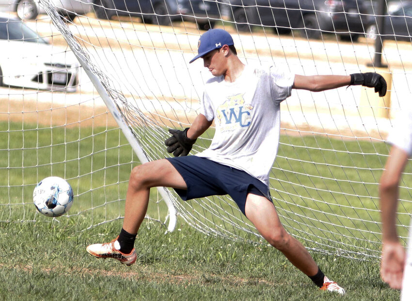 Goalie Drew Elsenrath attempts to make a kick save during practice earlier this month.