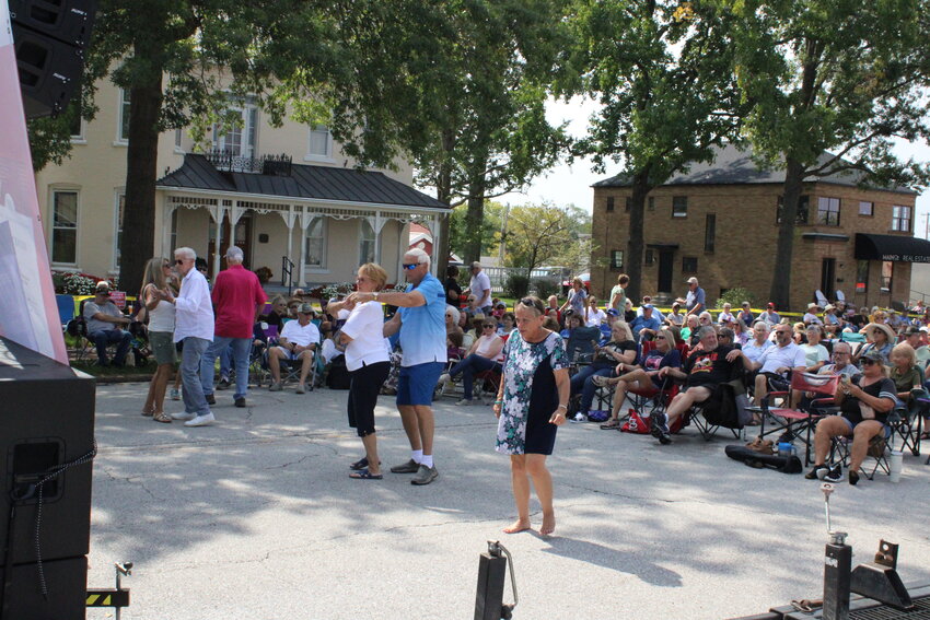 People dance on Main Street near the beginning of the Fall Festival while Butch Wax &amp; The Hollywoods played.