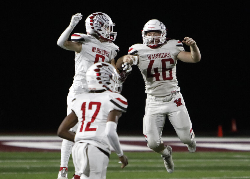 Warrenton linebacker Kadin Stroer (right) celebrates with Ben Peth (left) during Warrenton&rsquo;s 53-14 win over St. Charles West.
