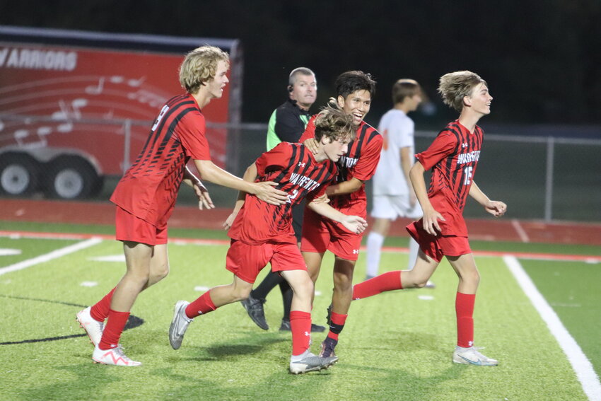 Warrenton&rsquo;s Nolan Donovan (second from left) and Bryan Guerrero (right) celebrate after Donovan scored a goal in the second half of Warrenton&rsquo;s 3-2 home loss to North Point last week.