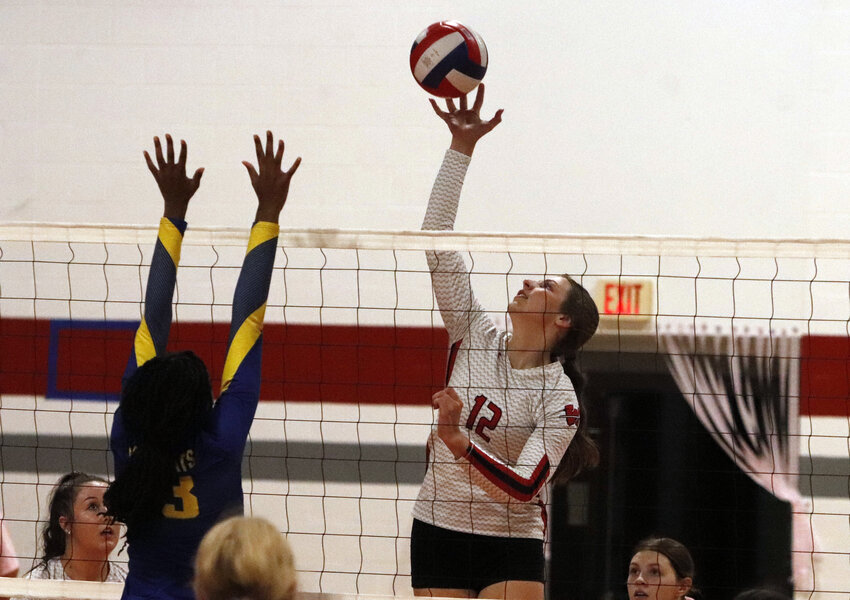 Nicole Benne (right) reaches for the ball during Warrenton&rsquo;s win over Wright City last week.