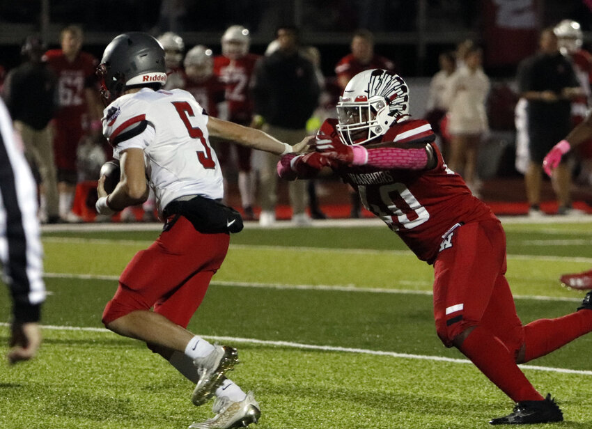 Warrenton's Javon Jones (right) reaches to make a tackle during the first half of Warrenton's win over Mexico.