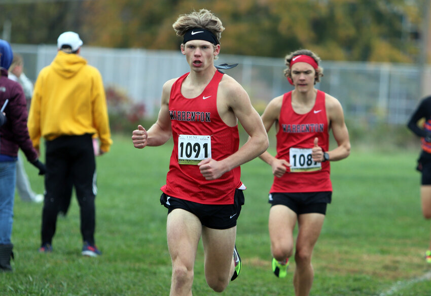 Warrenton seniors Phillip Kackley (front) and Wyatt Claiborne compete in the Class 4, District 3 meet last week at St. Vincent Park in St. Louis.