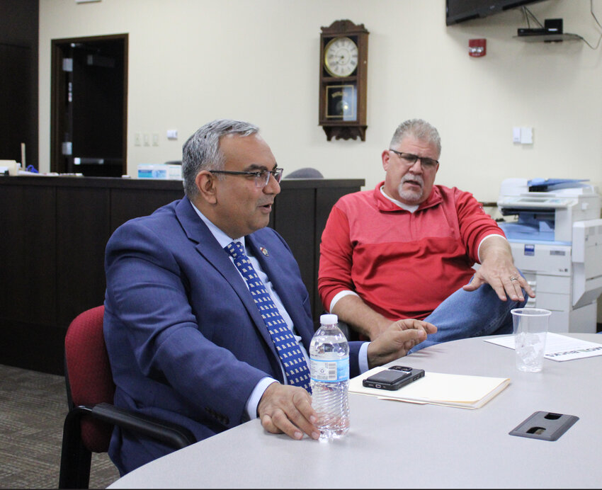 Vivek Malek talks with Warren County Presiding Commissioner Joe Gildehaus during the Missouri state treasurer's visit to the county.