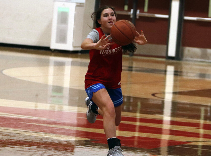 Isabel Benke passes the ball during practice.