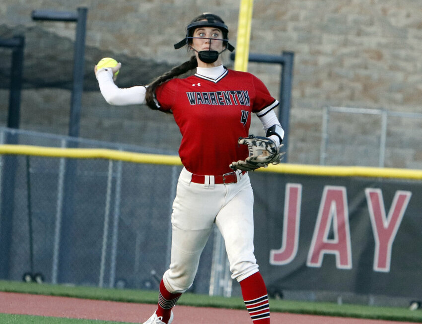 Kiera Daniel throws the ball to first base during the district championship game this season.