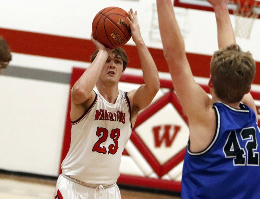 Warrenton senior Joe Goldsmith scores three of his team-high 21 points in Friday&rsquo;s home win over Hermann.