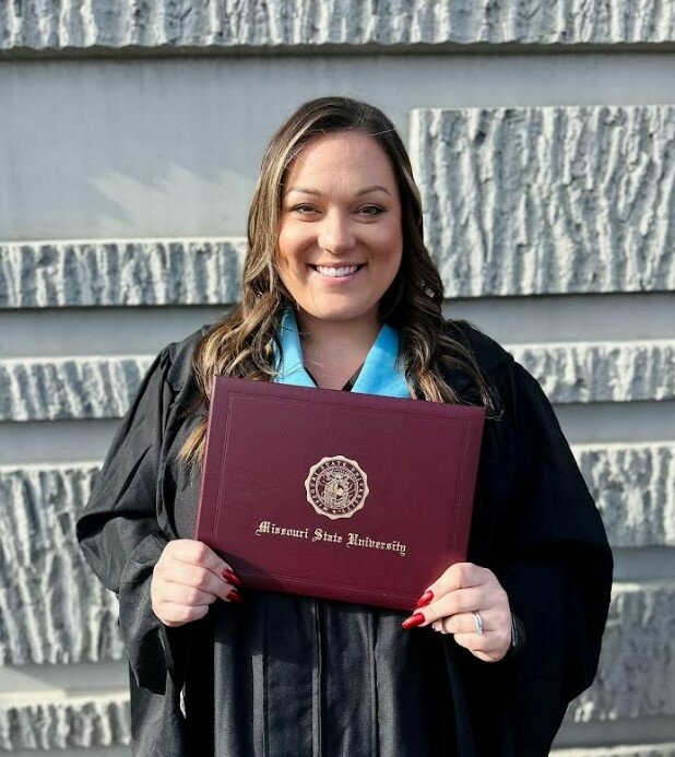 Brianna Franz poses with her master&rsquo;s degree after completing the Pathway for Paras program with Missouri State University. Franz, a Warrenton High School alumna, is now a teacher at Rebecca Boone Elementary School.