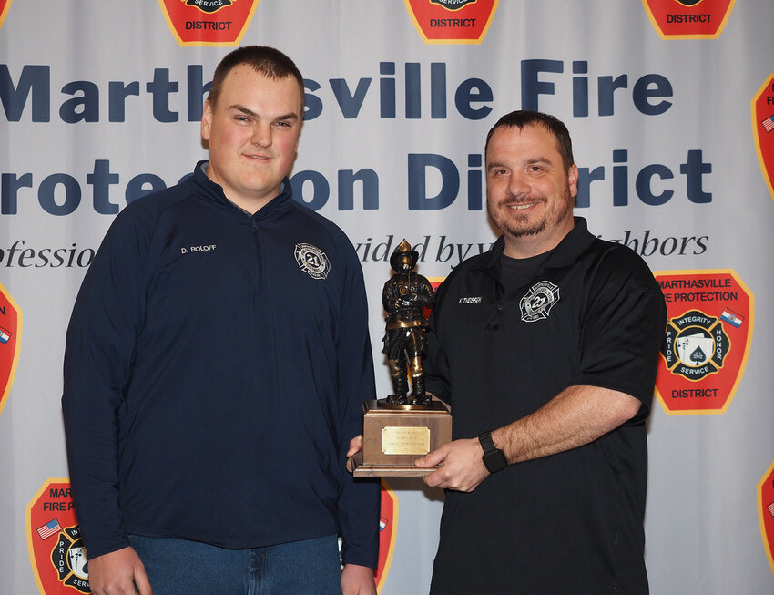 Engineer/Rescue Technician Keith Theissen, right, was voted 2023 Firefighter of the Year by his peers. Theissen views the Marthasville Fire Protection District as his family and is motivated by them to serve many volunteers hours supporting the department. Theissen was presented the award by Derek Roloff of the awards committee on Saturday, Jan. 20.