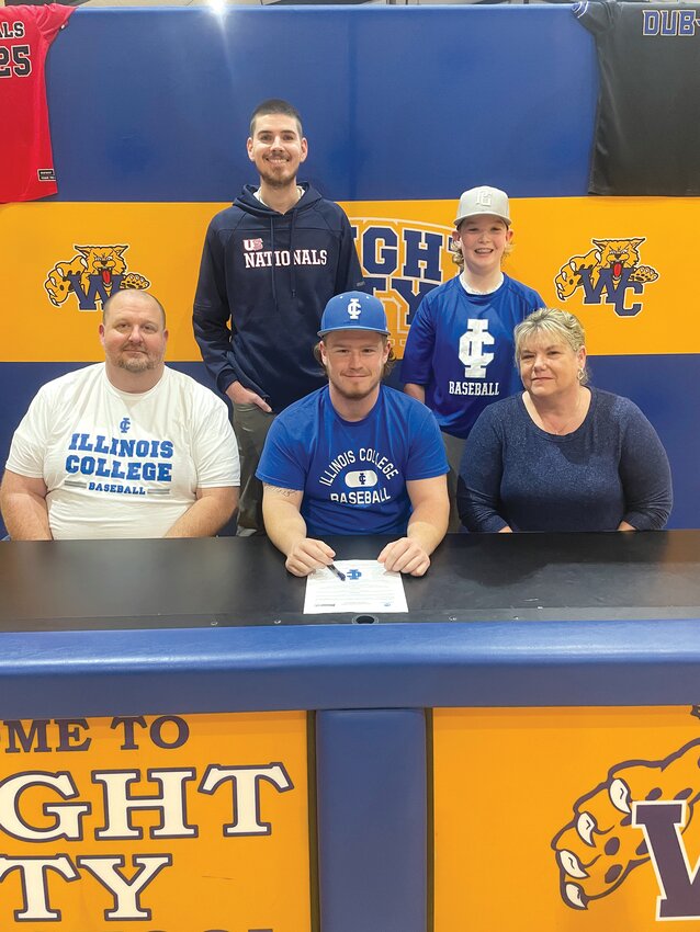 Wright City senior Bryce Williams recently committed to playing baseball at Illinois College. Seated with Williams are his parents, Freddy and Christy Williams. Standing, from left, are Zack Rutter, U.S. Nationals summer coach; and Colten Williams, brother.