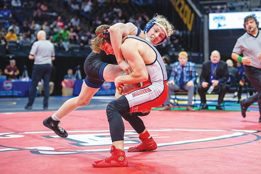 Warrenton’s Jeremiah Kassing wrestles Hillsboro’s Jordan Penick in the Class 3 third-place match at 126 pounds. Kassing was pinned in the second period. He was one of five state medalists for the Warriors.