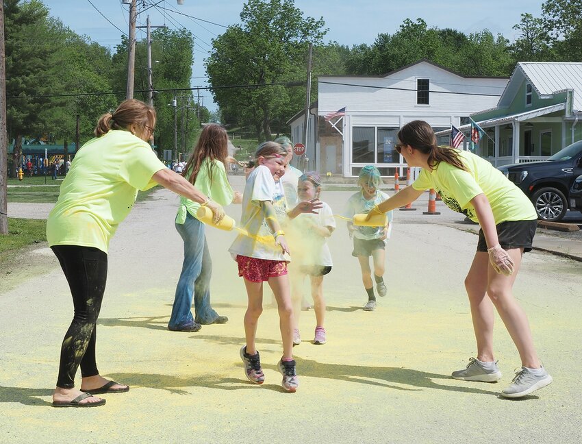 Students from Marthasville Elementary School participated in a Color Run to raise money for a school-wide field trip Saturday, May 4 at the Marthasville City Park. Teachers and staff held squirt bottles of all colors and tried to apply the color as the students ran by.