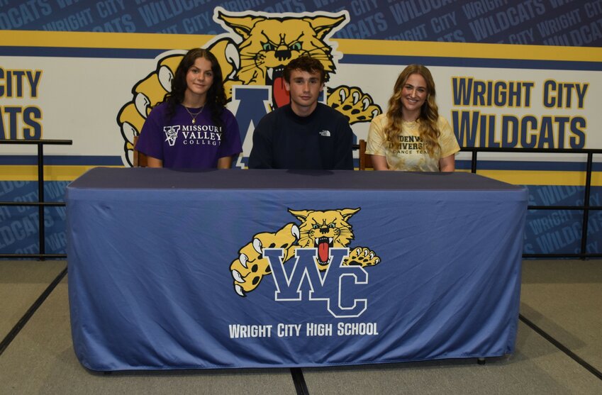 Wright City seniors Elizabeth Riggs, from left, Joey Gendron and Zoe Ervin last week signed letters of intent to compete in college. Riggs will attend Missouri Valley College for wrestling, Gendron will play football at William Woods University and Ervin will compete in dance at Lindenwood University.
