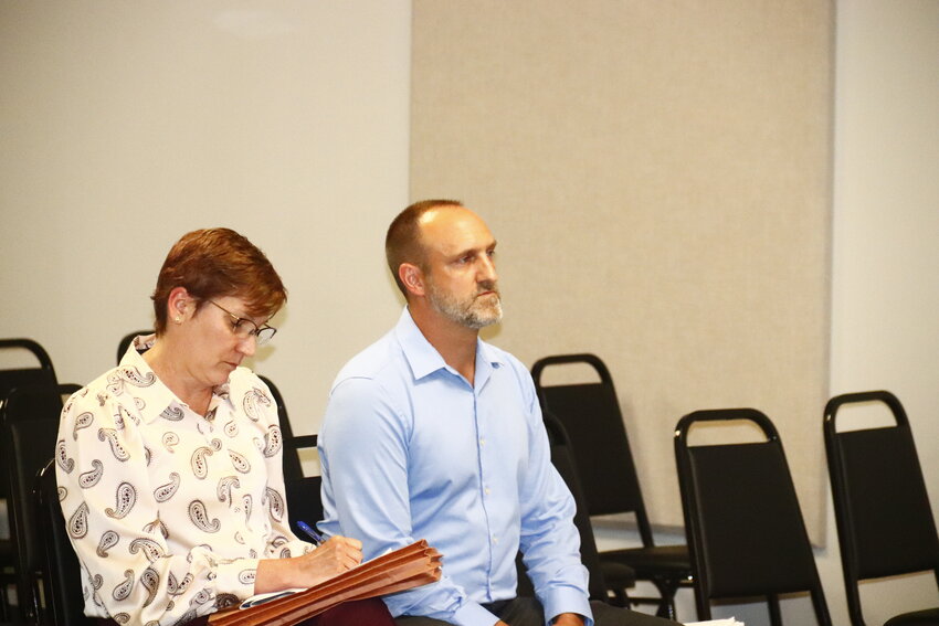 Elizabeth Lum, left, and project engineer Tom Burke, right, in attendance at the July 16 meeting.