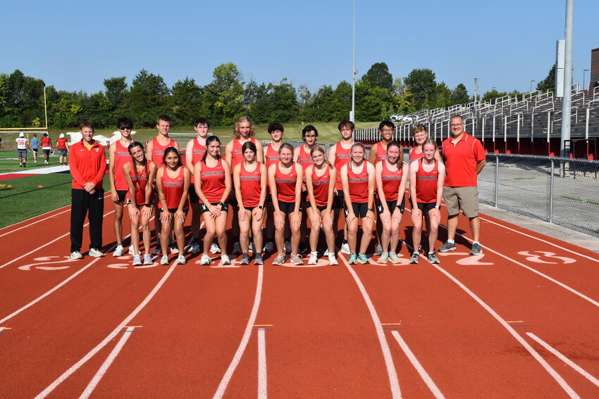 Members of the Warrenton boys and girls cross country team are front row, from left: Alexis Ruff, Melanie Guerrero, Nova Weekly, Sophie Bennet, Mailia Hopper, Abigail Kackley, Taryn Sharp, Jadyn Hopper and Madeline Schoppenhorst. Back row, from left: Coach Jeremy Collins, Jonathan Sweitzer, Matt Craven, Dylan Coleman, Noah Cline, Trenton Hummel, Jacob Beckemyer, Korben Johnson, Ken Le, Noah Joens and Coach Mike Shaw.