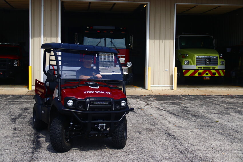 Volunteer Firefighter Kyle Creech sits in the new Kawasaki side-by-side at Wright City Fire Protection District Station 3.