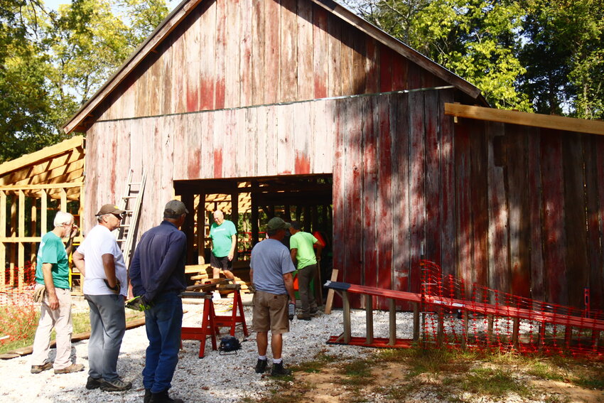 Volunteers for the Innsbrook Historical Society wrap up work on the barn on Sept. 12. The restoration of the barn  is in progress and nearing completion as additions like lean-tos on the sides are built.