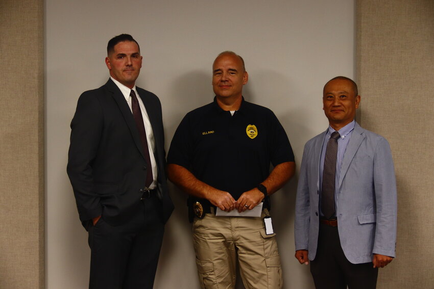 Pictured from left to right: Frank Ashby, Warrenton Police Chief Larry Ellard and Taro Nagatani.