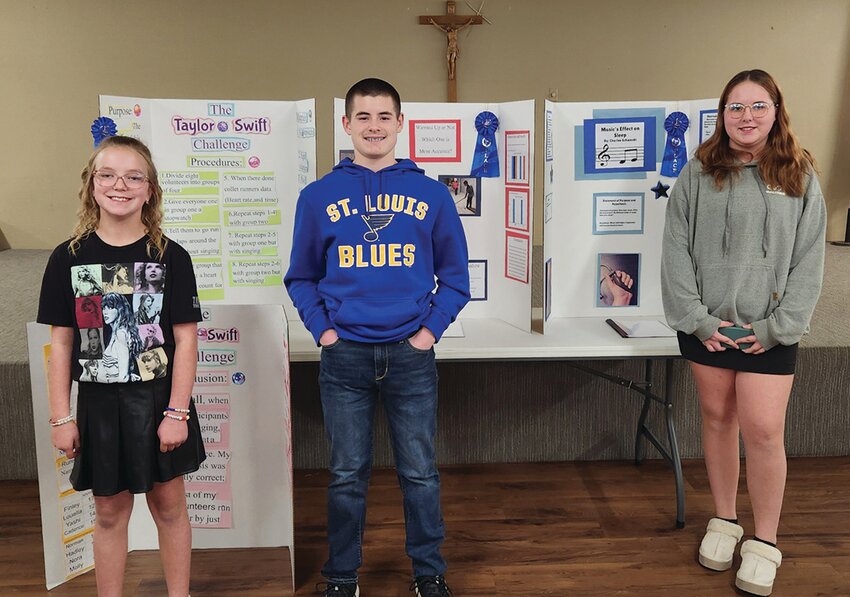 Pictured from left, Isabelle Bortz, in first, for her exploration into how singing songs affects running, Mitchell Daly, in second, for testing the effects of warming up on shot accuracy in hockey and Charlee Schwerdt, in third, for charting changes in blood pressure in reaction to different kinds of music.