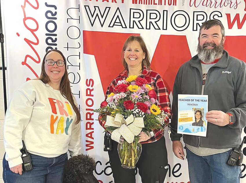 Mrs. Virginia Sparks was named Rebecca Boone Elementary&rsquo;s Teacher of the Year. Pictured with Assistant Principal Kathleen Carra, left, and Principal Steve Weeks, right.