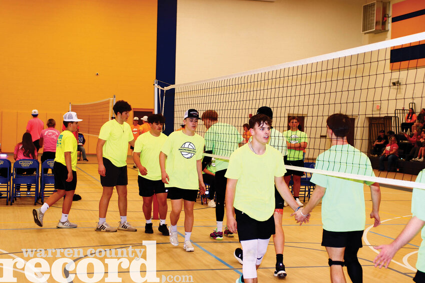 Pictured, members of the freshmen team, left and the junior team, right, shake hands after their first game of the tournament.
