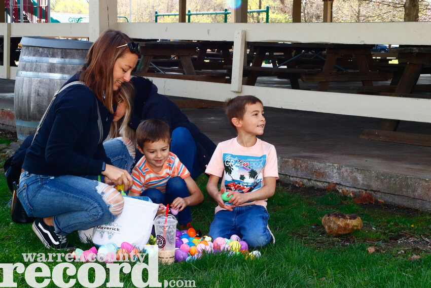Heather Pokorny, left, and her sons Colton, 4, and Maverick, 7, dig through their stash of candy following the Easter egg hunt in Wright City at Diekroeger Park on April 12. The event in Wright City included hundreds of eggs and was divided into age groups. Kids also received a visit from the Easter Bunny at the park, who arrived with the Wright City Fire Protection District.