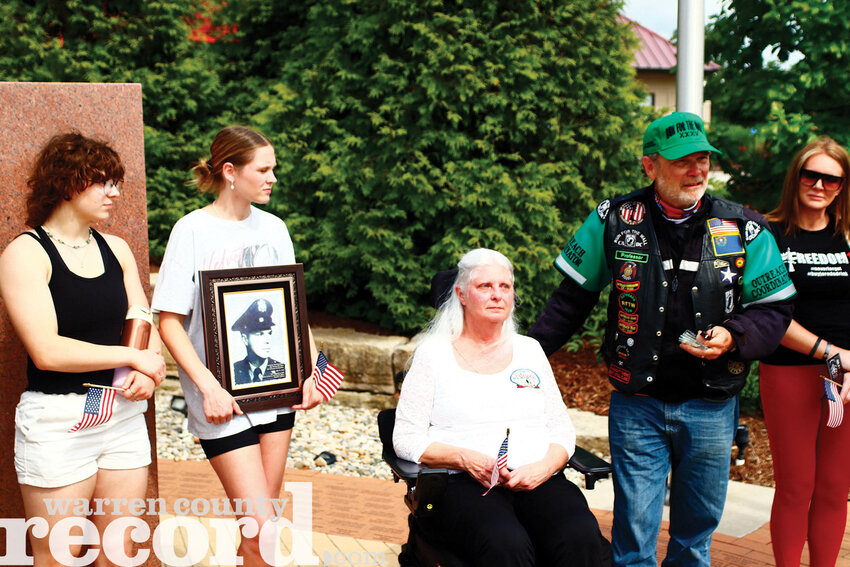 The annual Run for the Wall Motorcycle Ride passed through Warrenton on the afternoon of May 19 and an outreach team met with local Gold Star Families at the Tribute to Veterans Memorial in Warrenton prior to their arrival. The Run for the Wall honors Vietnam veterans as riders travel across the country from California to the Vietnam War Memorial in Washington D.C. Members of the outreach team held a brief service at the memorial and presented Gold Star Families with a star commemorating their loved ones who made the ultimate sacrifice. Pictured, from left, Gold Star Family members Allison Vacek and Olivia Clarke with their grandmother Beth Vincent, whose father was killed in action in the Korean War. Fred Aldrich, right, of the outreach team, recognized her father, along with the other Gold Star Families in attendance for their family members' service.