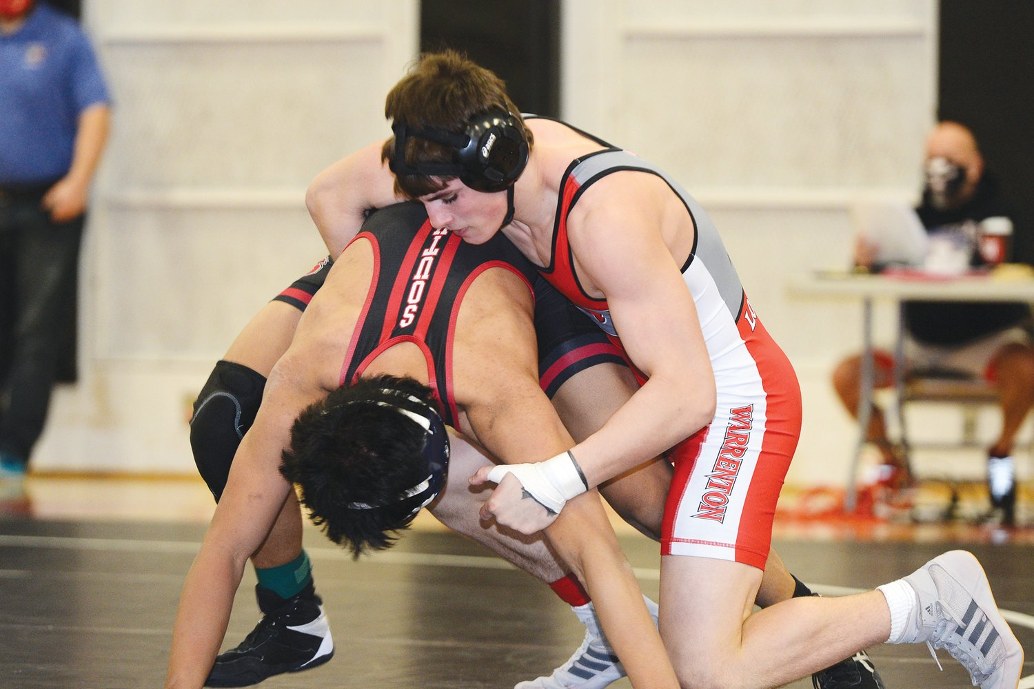 STATE BOUND — Warrenton’s Anthony Lombardo, right, qualified for state by finishing in the top three at Saturday’s sectional meet at 152 pounds.  Lombardo was the lone wrestler for the Warriors to advance to state as four other grapplers placed fourth.	Bill Barrett photo.