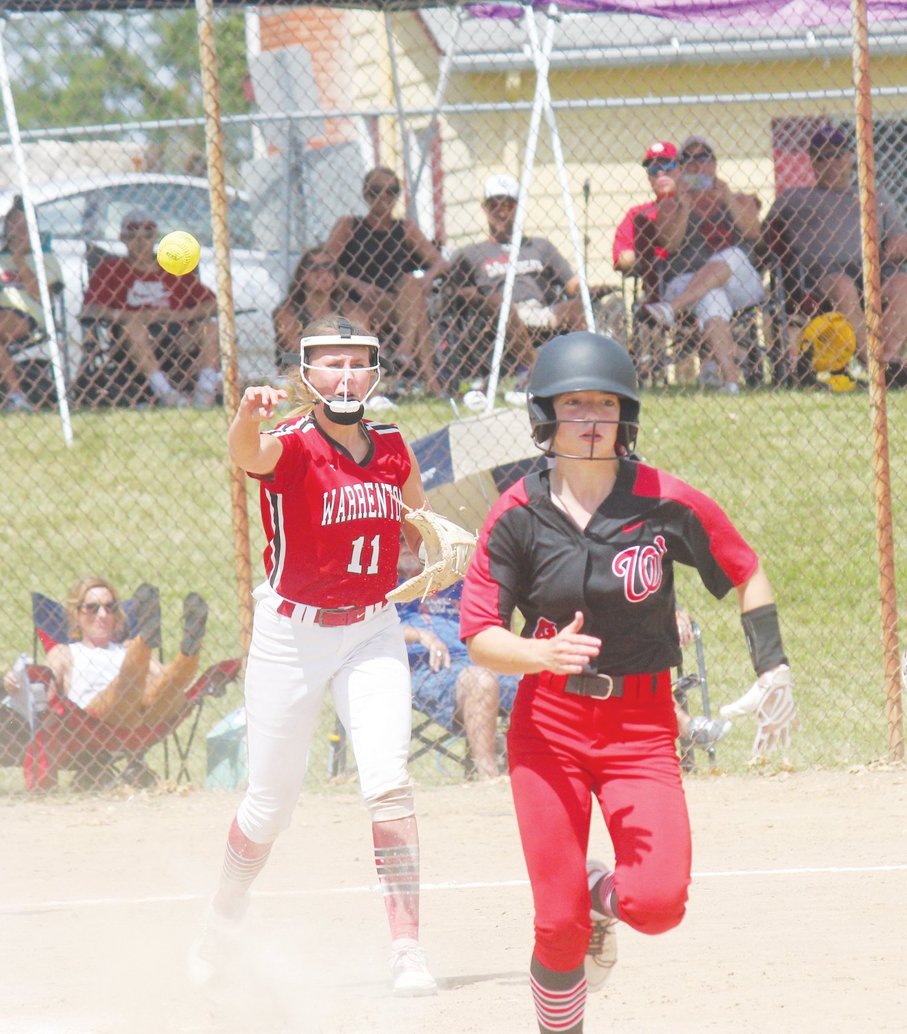 OPENING TOURNEY — Warrenton first baseman Kaylin Haas (11) throws to first base to retire a Winfield batter in Saturday’s action at the Troy Buchanan Tournament.