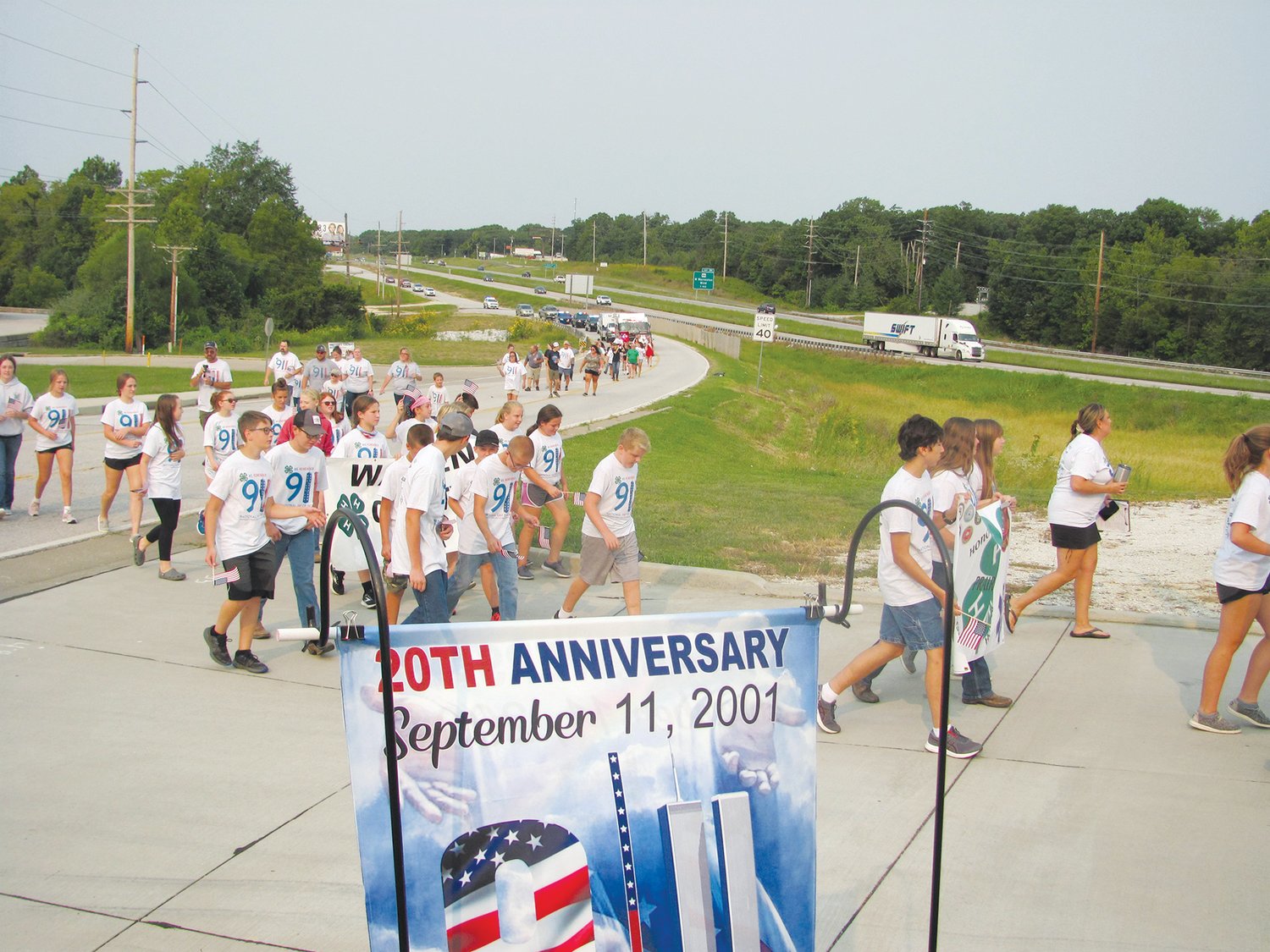 20TH ANNIVERSARY OF 9/11 — 4-H members, their families and members of the community walk to the Warren County Tribute to Veterans Memorial in Warrenton as part of a ceremony to mark the 20th anniversary of the 9/11 terrorist attacks.