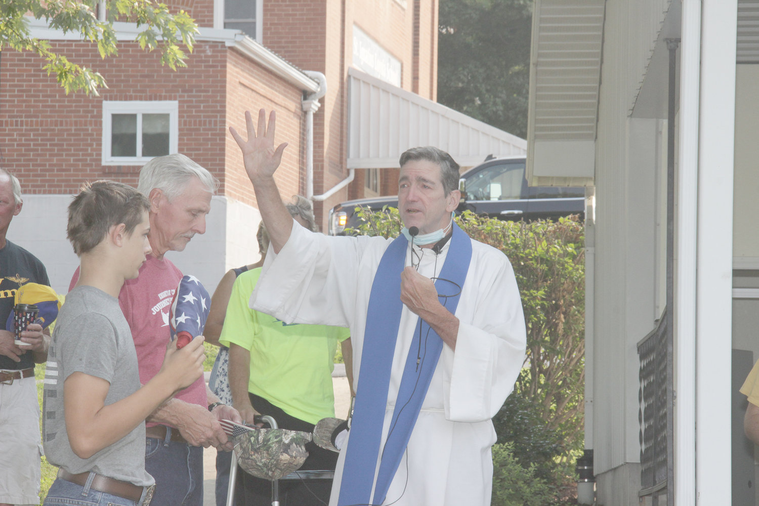 Fr. Steve Robeson blesses the fleet at St. Ignatius Parish ahead of the 2021 Journey For Charity Tractor Cruise through southern Warren County.