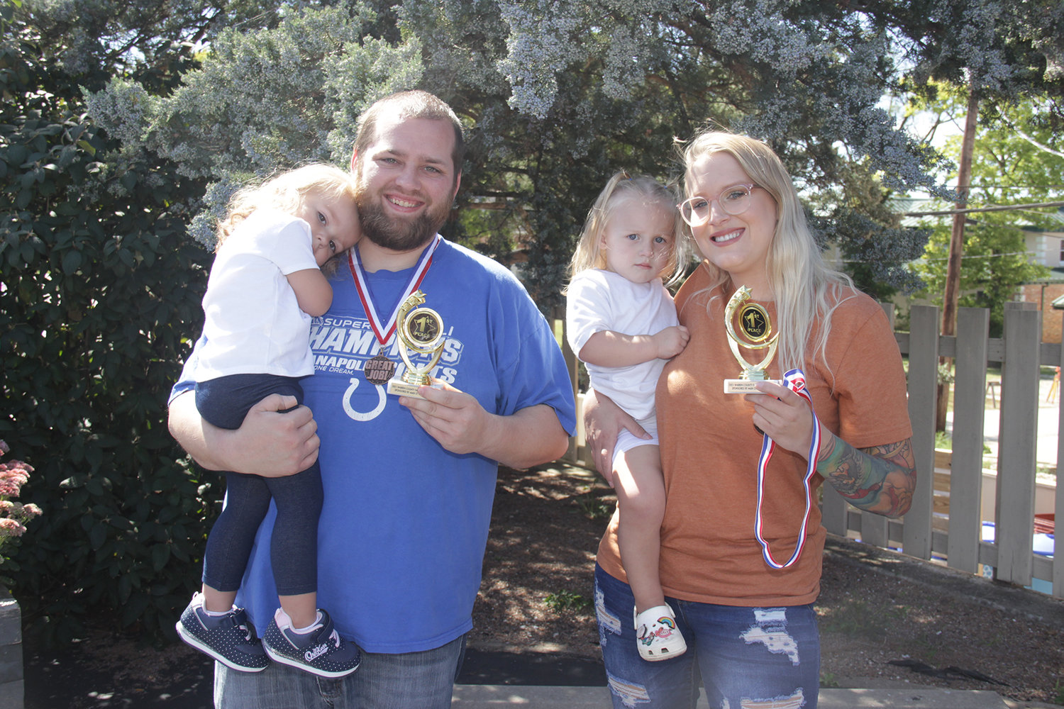 BABY CONTEST 25-30 MONTHS — Shared first place: Norah Adkins, held by Jake Adkins, and Kayzlee Haselhorst, held by Alexis Mills.