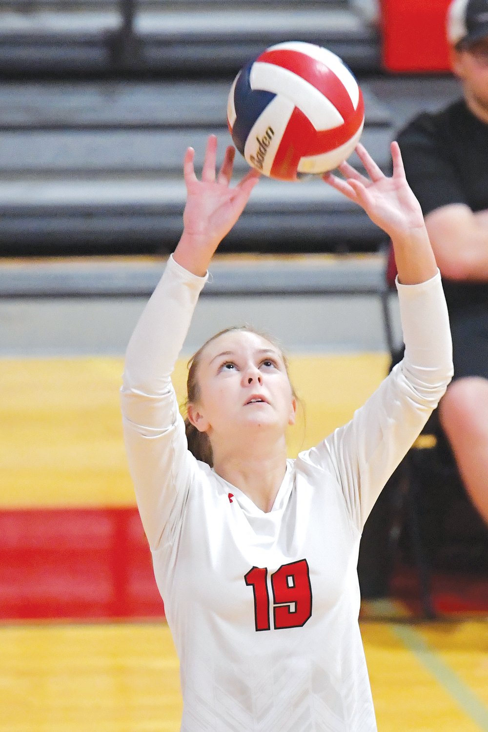 FOURTH-PLACE FINISH — Warrenton’s Emily Likes makes a set during a game earlier this season. The Warriors went 3-3 in the Megan Gross Invitational Saturday.