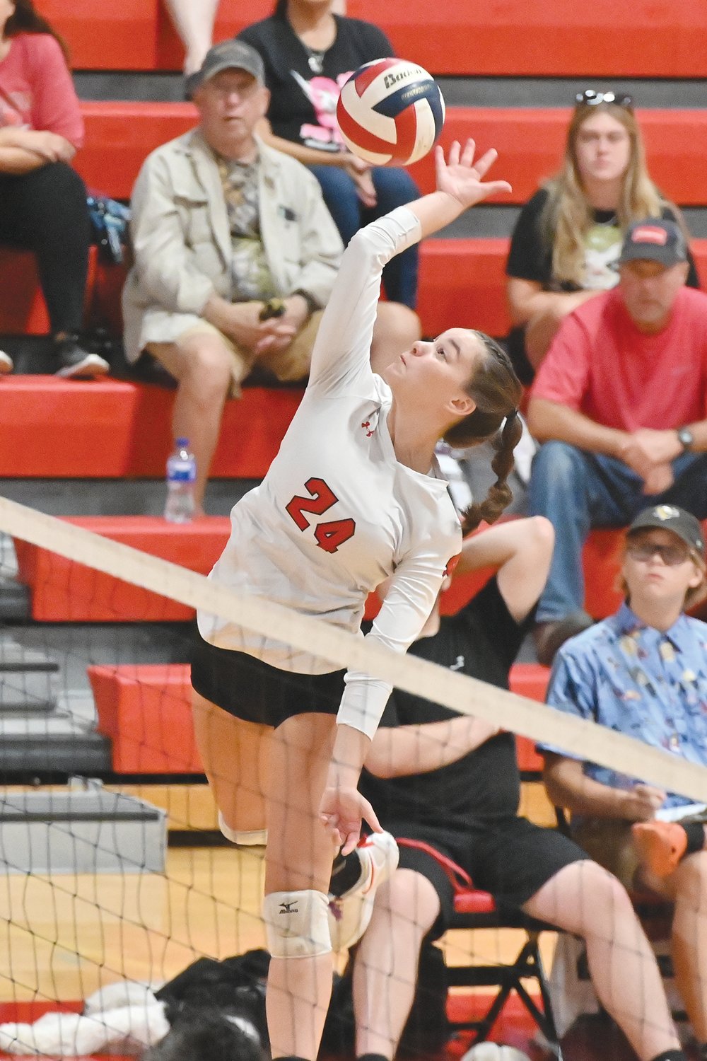 Warrenton's Zoe Klaus goes for a kill in a game earlier this season. The Warriors wrapped up a conference title for the second straight year last week.