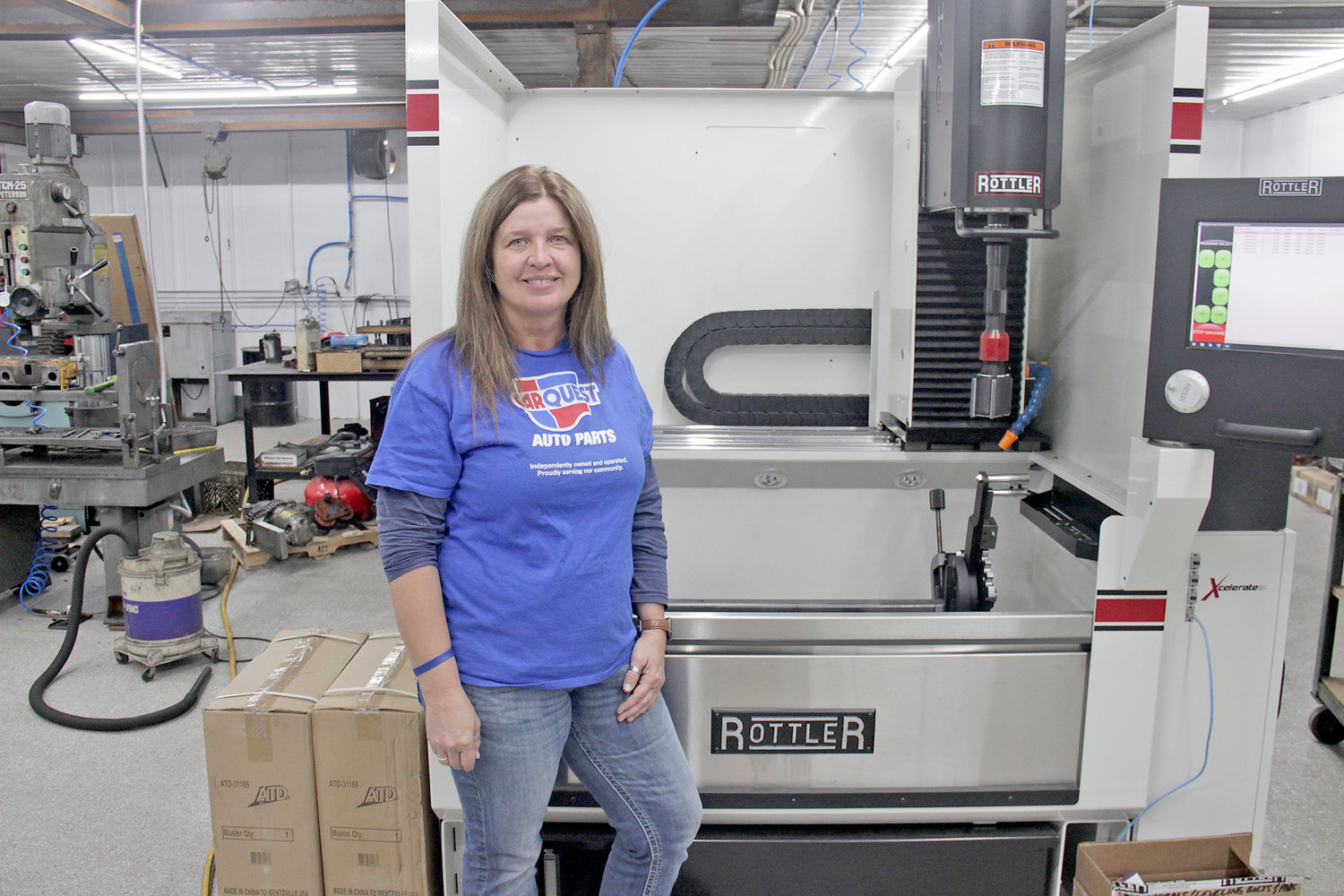 FROM DRIVER TO OWNER — Owner Jessica Curtis walks through the newly renovated and upgraded machine shop at the Warrenton location of Double J Auto Parts. Curtis started out as an auto parts delivery driver in Montgomery City.