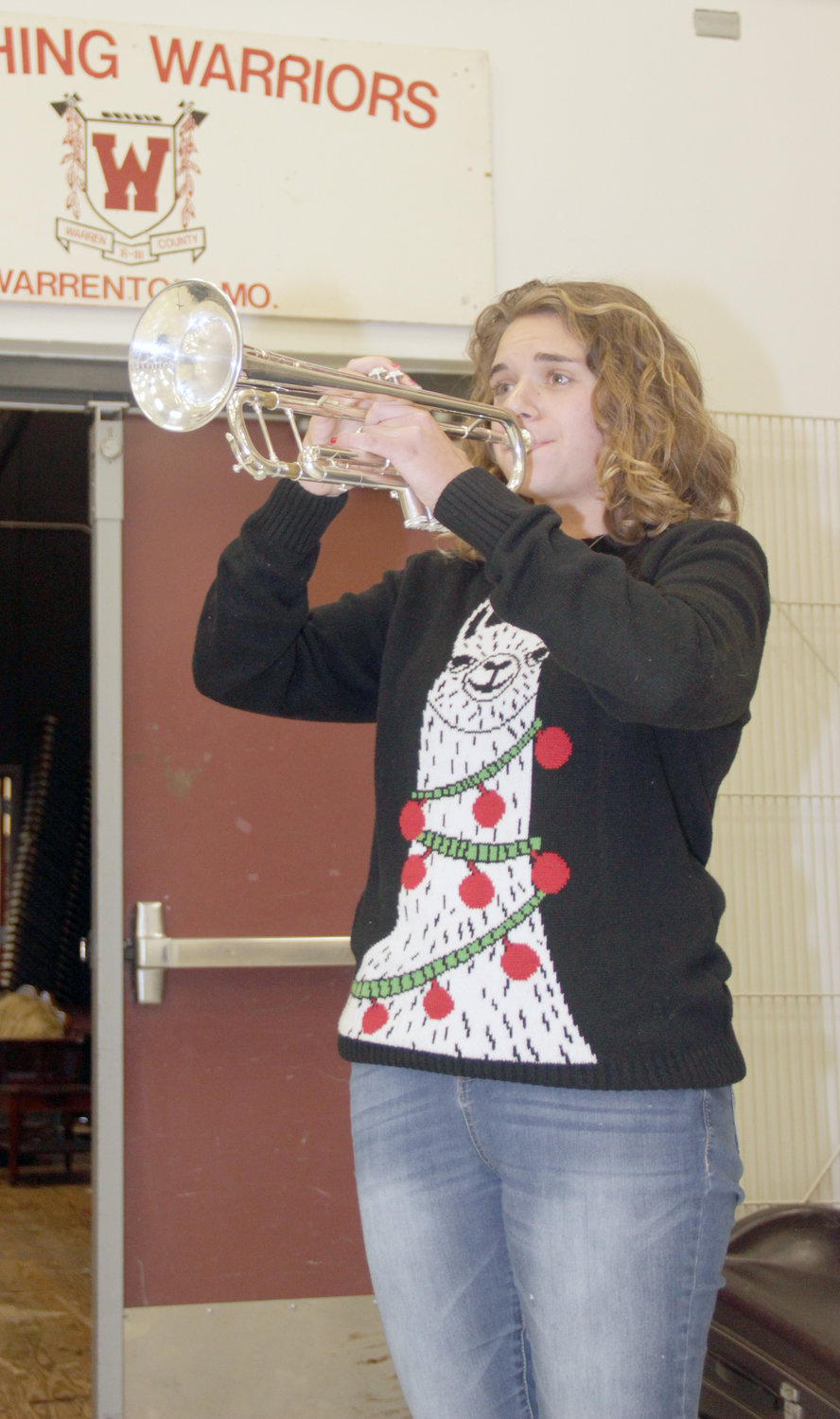 MUSIC DEDICATION — Warrenton High School junior Shelbi Tittel rehearses the Warrenton Marching Band’s fight song in the school’s band room in December. After months of practice, Tittel was selected as one of only 108 performers in the Missouri All-State Band, which will perform this month.