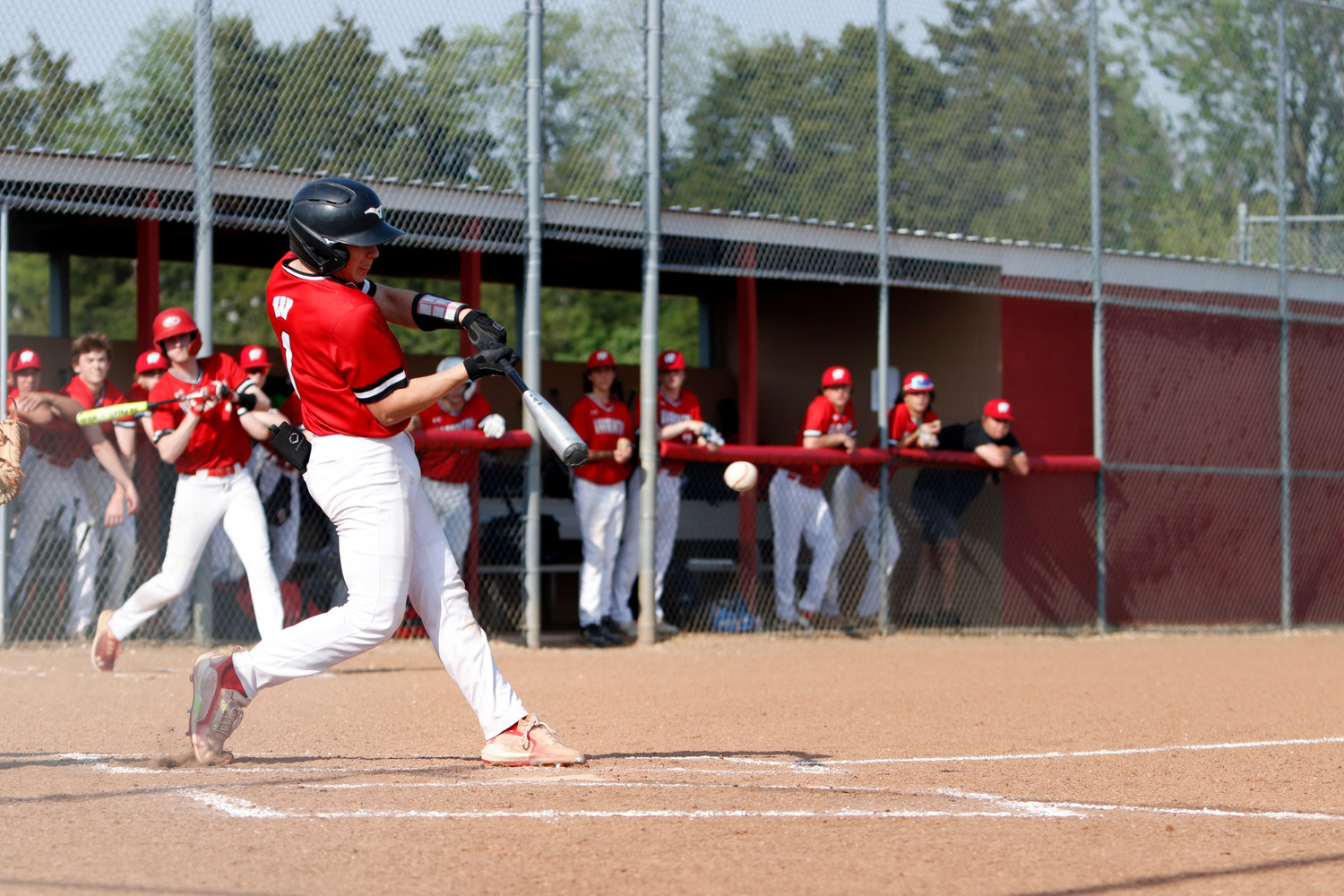 Austin Haas hits the ball during the third inning of Monday’s game against St. Charles West.