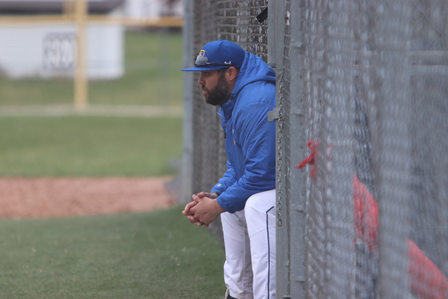 Wright City baseball coach Ryan Raterman watches from the dugout during a game earlier this season.