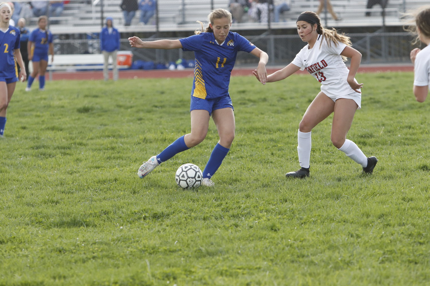 Paige Rees (left) looks to get past Winfield defender Jessi Rudar during a game earlier this season.