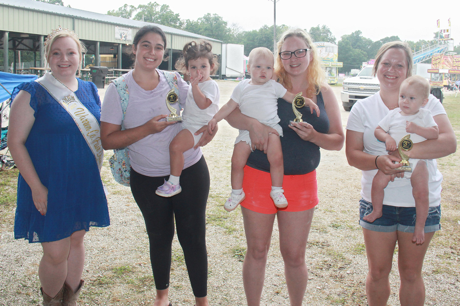 13-18 MONTHS
First place: Ava Lanham, held by Jodi Lanham. Second place: Adelynn Frankenberg, held by Samantha Hackett. Third place: Ethan Jarvis, held by Alexia Jaggie.