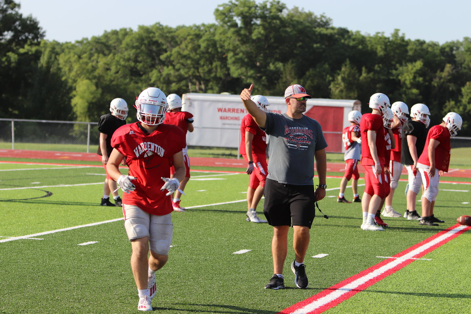 Warrenton football players participated in the high school football camp last week. In the photo, head coach Jason Koper coaches the team during the last day of camp.
