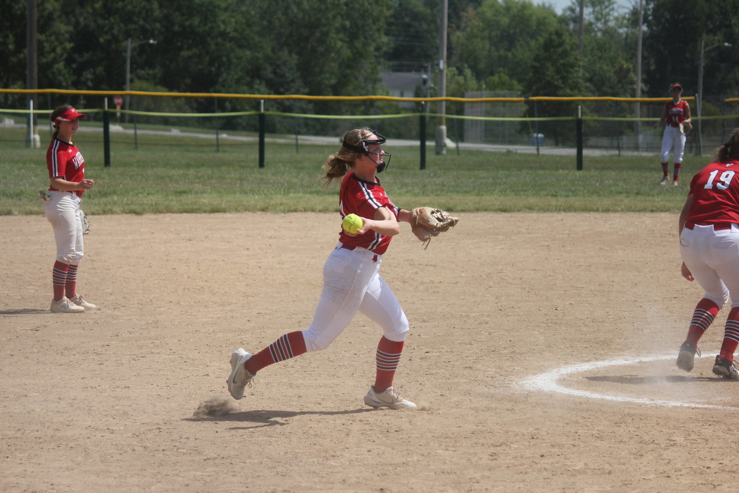 Mackenzie Hurst throws the ball to first base during a game last season. Hurst is the lone senior on the Lady Warriors this season.