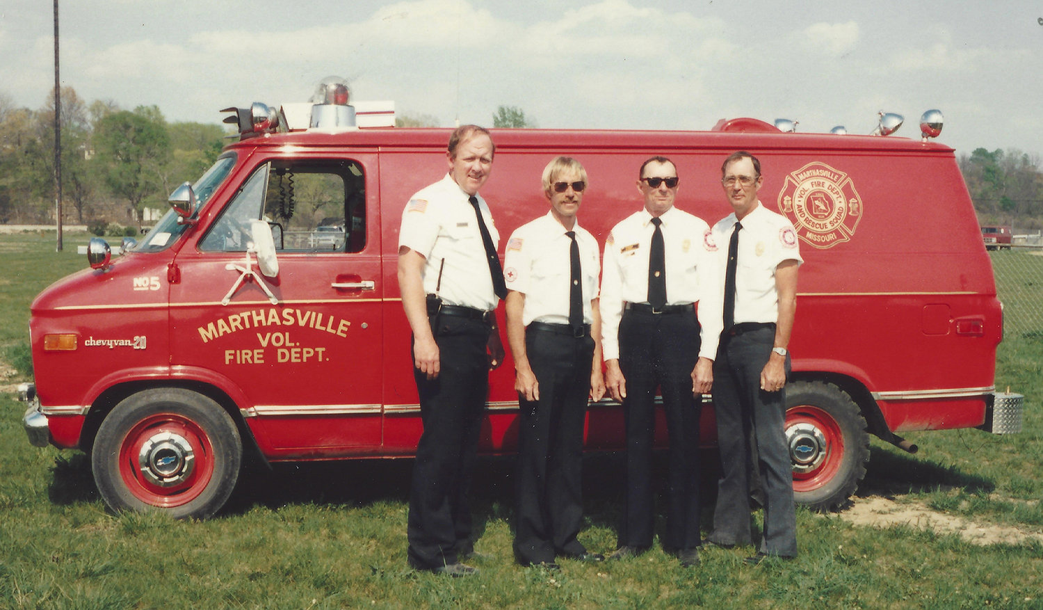 THROUGH THE YEARS — Then-Asst. Chief Jim Buescher, left, is pictured with fellow Marthasville Fire Department volunteers in 1986. Pictured, from left, are Buescher, Chief Larry Ballmann, Retired Chief Frank Pohl, and Asst. Chief Murrill Wohler.