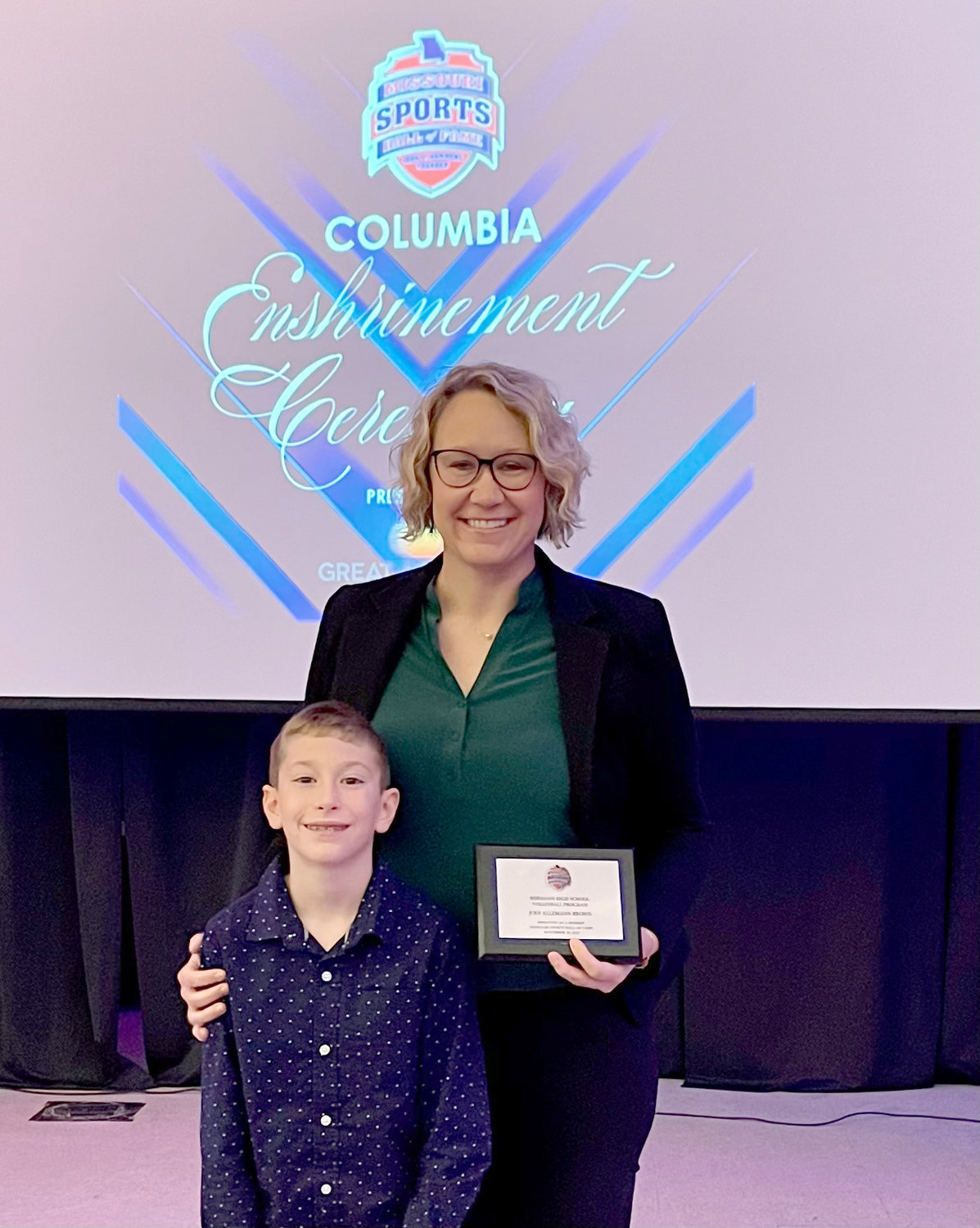 SPORTS LEGACY — Dr. Jodi Brown, the assistant principal at Daniel Boone Elementary, attended the Missouri Sports Hall of Fame enshrinement ceremony with her son, Jacob, on Nov. 20. Brown and other former players were honored during the Hall of Fame induction of the Hermann High School volleyball program.