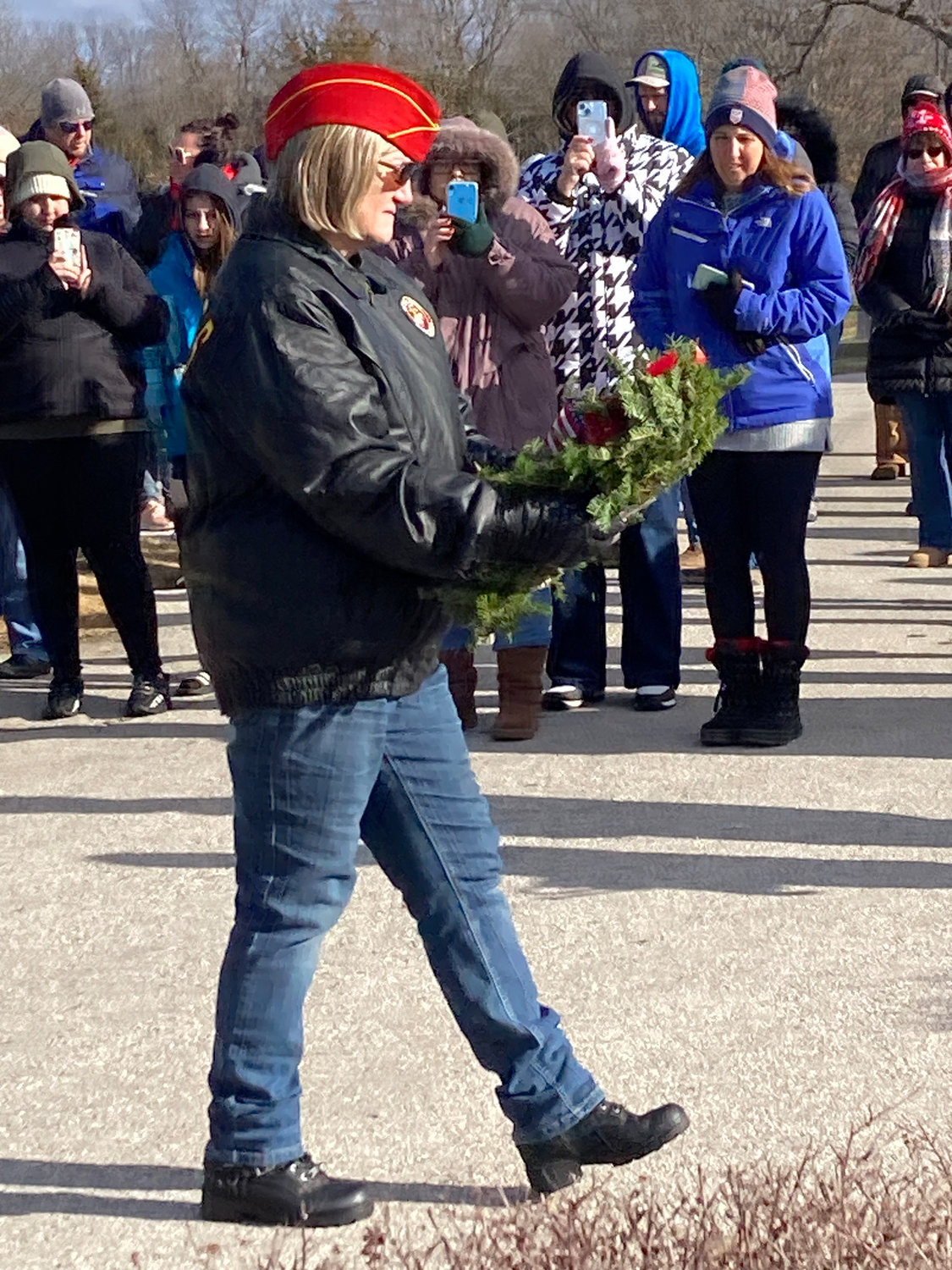 MILITARY HONORS — Julie Harris presents a memorial wreath in recognition of all members of the U.S. Marine Corps during a Wreaths Across America Ceremony at the Warrenton City Cemetery on Dec. 17. Each branch of the military, as well as servicemembers recorded as prisoners of war or missing in action, are memorialized at events throughout the nation each year.