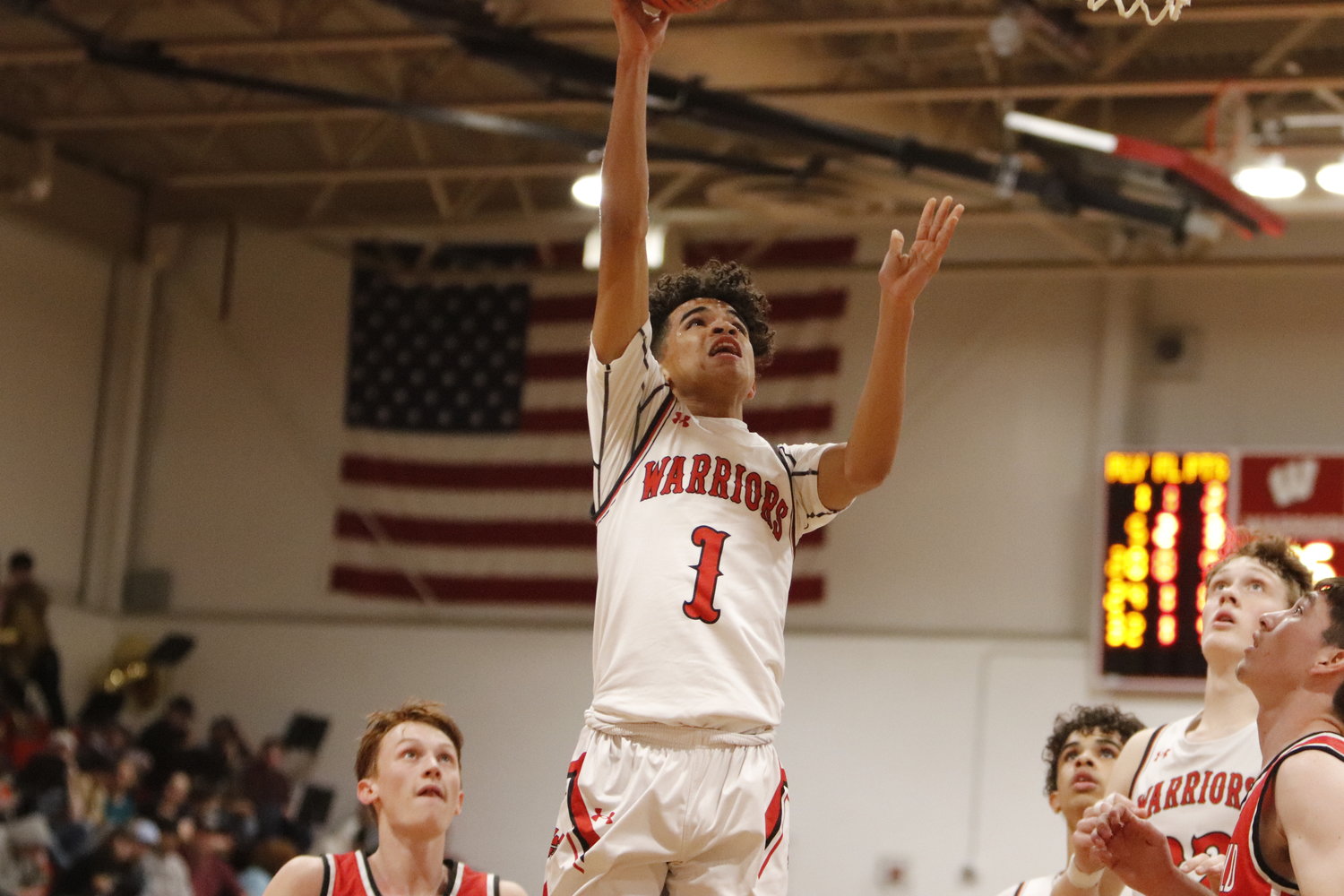 Deacon Forrest scores two of his four points during Tuesday’s conference win over Winfield.