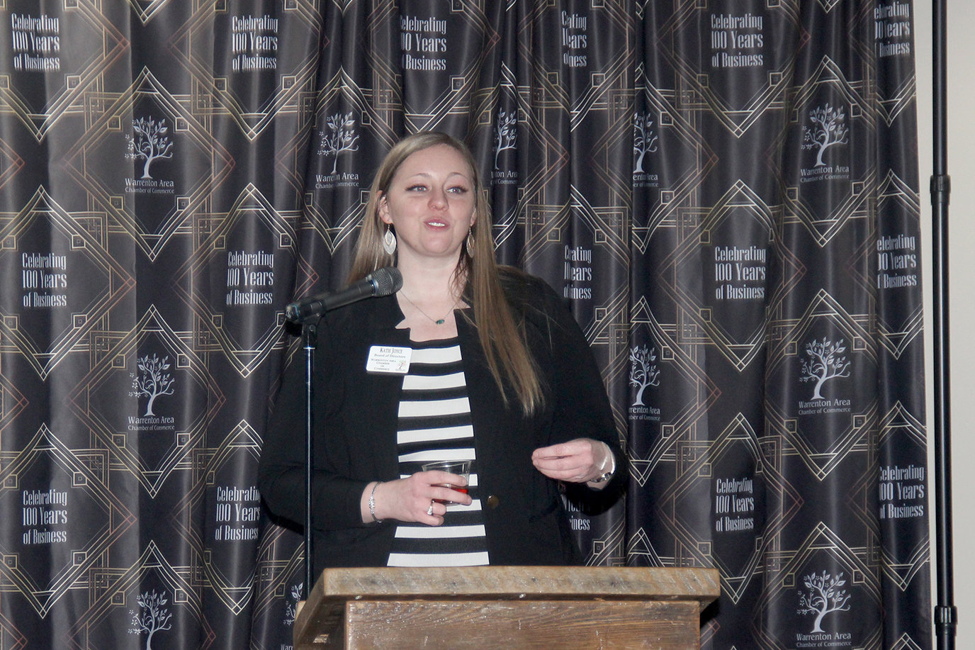 LEADING CELEBRATION — Warrenton Chamber of Commerce President Katie Joyce provides complimentary remarks at the beginning of a Jan. 13 banquet and awards ceremony marking the Chamber’s 100th anniversary.